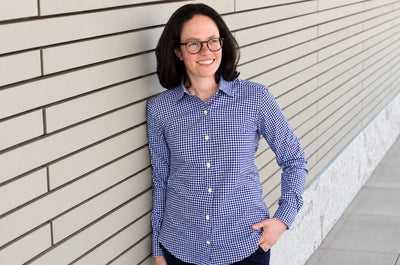 A woman in the Tuckerman navy gingham shirt